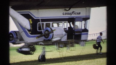 1970: man leaving goodyear aircraft with duffel bag in daylight MINNESOTA