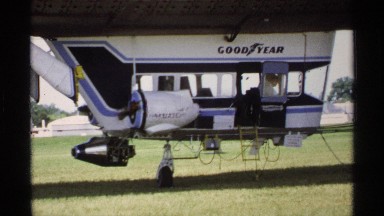 1970: goodyear airplane in the grass preparing for takeoff. MINNESOTA