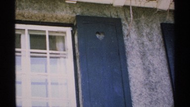 1970: steady video of a window and a shutter. MINNESOTA