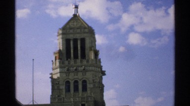 1970: an old stone cathedral tower seen on a lightly cloudy day MINNESOTA