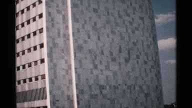 1970: a long building with more floors looks like an large size of apartment and