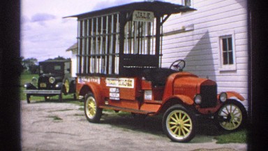 1970: a daytime scene a custom truck is waiting in front of a single family