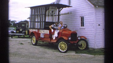 1970: woman steps down from paddy wagon followed by man seated behind wheel