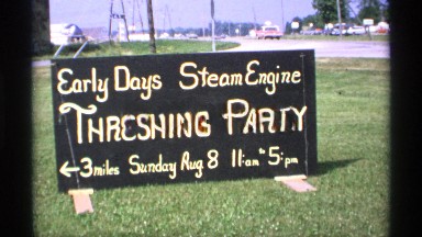 1971: a road side sign advertises a steam engine threshing party MINNESOTA