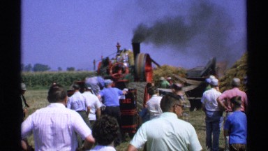 1971: large group of people watching a piece of machinery with smoke MINNESOTA