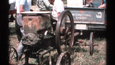 1971: a vehicle is pulling a machine through a dry field. MINNESOTA