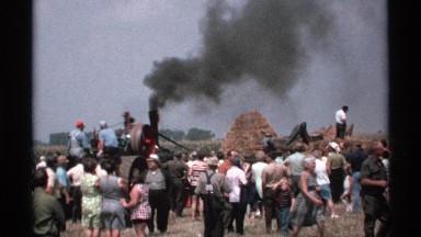 1971: a vehicle pull out the impure air and people are watching at the open
