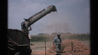 1971: a machine that pushes the sands at one place and some people they look