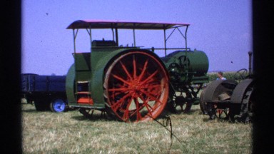 1971: man observing farming equipment parked on a lot. MINNESOTA