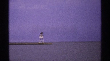 1971: Two White Lighthouses on Isle Royale, Michigan, with Open Sea
