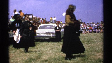 1971: a large group of people are celebrating get together ladies are walking
