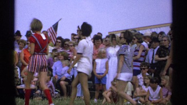1971: young people participating in a summer clothes contest at the beach