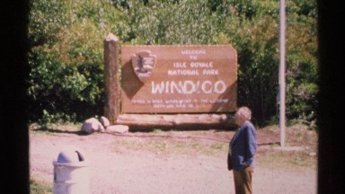 1972: a board at the ground place that has the place history and a small statue