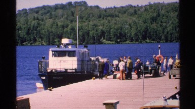 1972: group of people on a dock waiting to board a boat. ISLE ROYALE MICHIGAN