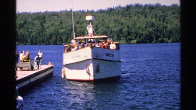 1972: a ship full of people that try to parking the corner of the river a man