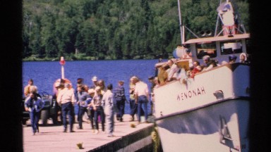 1972: people disembarking from a boat on a lake ISLE ROYALE MICHIGAN