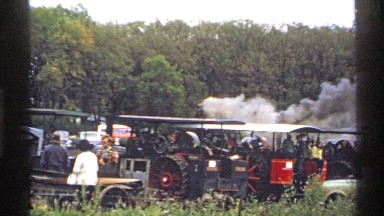 1971: the chimney of a locomotive steam engine is spewing smoke in front of a