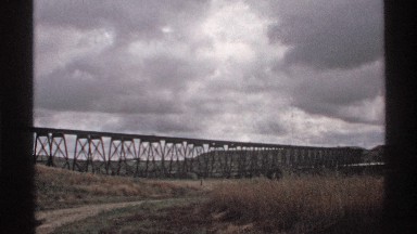 1972: suspended wooden railroad track on a windy day in the midwest NORTH DAKOTA