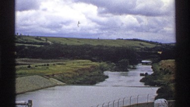 1972: beautiful landscape of hills, green grass, forests and flatland with a