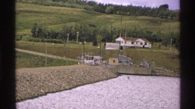 1972: blue lakeside facility with white building during spring time with