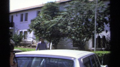 1975: people are talking outside from come out the car and get into their house