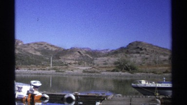 1975: a panoramic shot of a lake and boats on the late GUAYMAS MEXICO