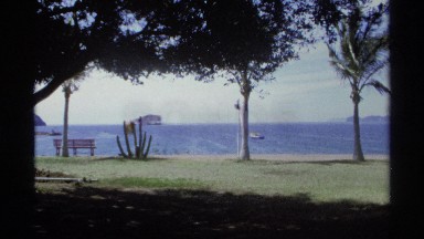 1975: a park and a man walking there at the corner a river also there and