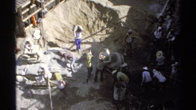 1975: workers are doing construction work to develop a building sincerely at the