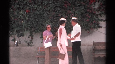 1975: One Man and Two Women Laughing and Talking in Guaymas, Mexico