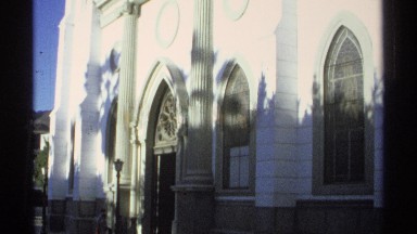 1975: a magnificent white painted church with towers under the clear blue sky