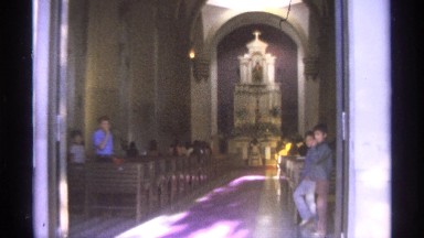 1975: everyone is standing along the aisle in church, as a young woman receives
