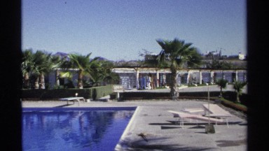 1975: 3 People Walking Beside Swimming Pool at Resort in Guaymas Mexico