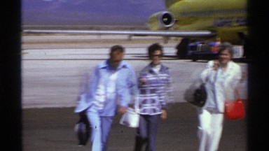 1974: three people walk on the ground after the airplane has landed safely LA