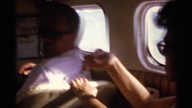 1974: guys are inside a vehicles to travel a long trip and taking with each