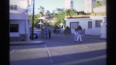 1975: people cross a busy side street in order to go eat. GUAYMAS MEXICO
