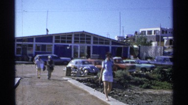 1975: a party of people walking back from an event to their vehicles. GUAYMAS