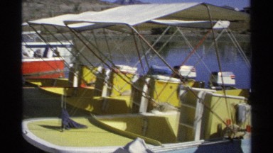 1975: a yard of ships while a group prepares to board one for the day. GUAYMAS