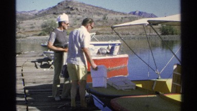 1975: two men loading boat and preparing for a day of fishing GUAYMAS MEXICO