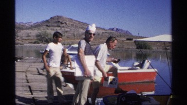 1975: Men and Women on a Boat Preparing for a Day of Fishing in Guaymas, Mexico