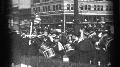 1937: a marching band pauses on the sidewalk to play some songs CLEVELAND OHIO