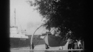 1938: a pillar and a ship moved near to there at the water and trees also near