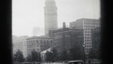 1938: huge pointy skyscraper sits in the city high above all other building and