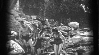 1938: a family enjoying a local water spot together while playing. CLEVELAND