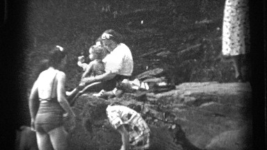 1938: group of ladies and children enjoy a summer day out sunning themselves and