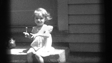 1939: black and white video of a young girl eating a lollipop CLEVELAND OHIO