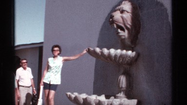 1974: three people posing in front of lion water wall on a wall. CABO SAN LUCAS