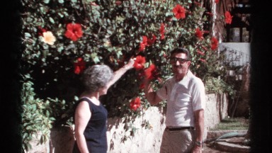 1974: man and woman picking flowers CABO SAN LUCAS MEXICO
