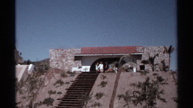 1974: zoom in shot on a group getting ready for a day in the sun. CABO SAN LUCAS
