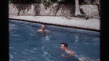 1974: two men swimming in a in-ground pool CABO SAN LUCAS MEXICO