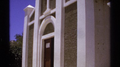 1974: a large red brick church adorned with a cross CABO SAN LUCAS MEXICO